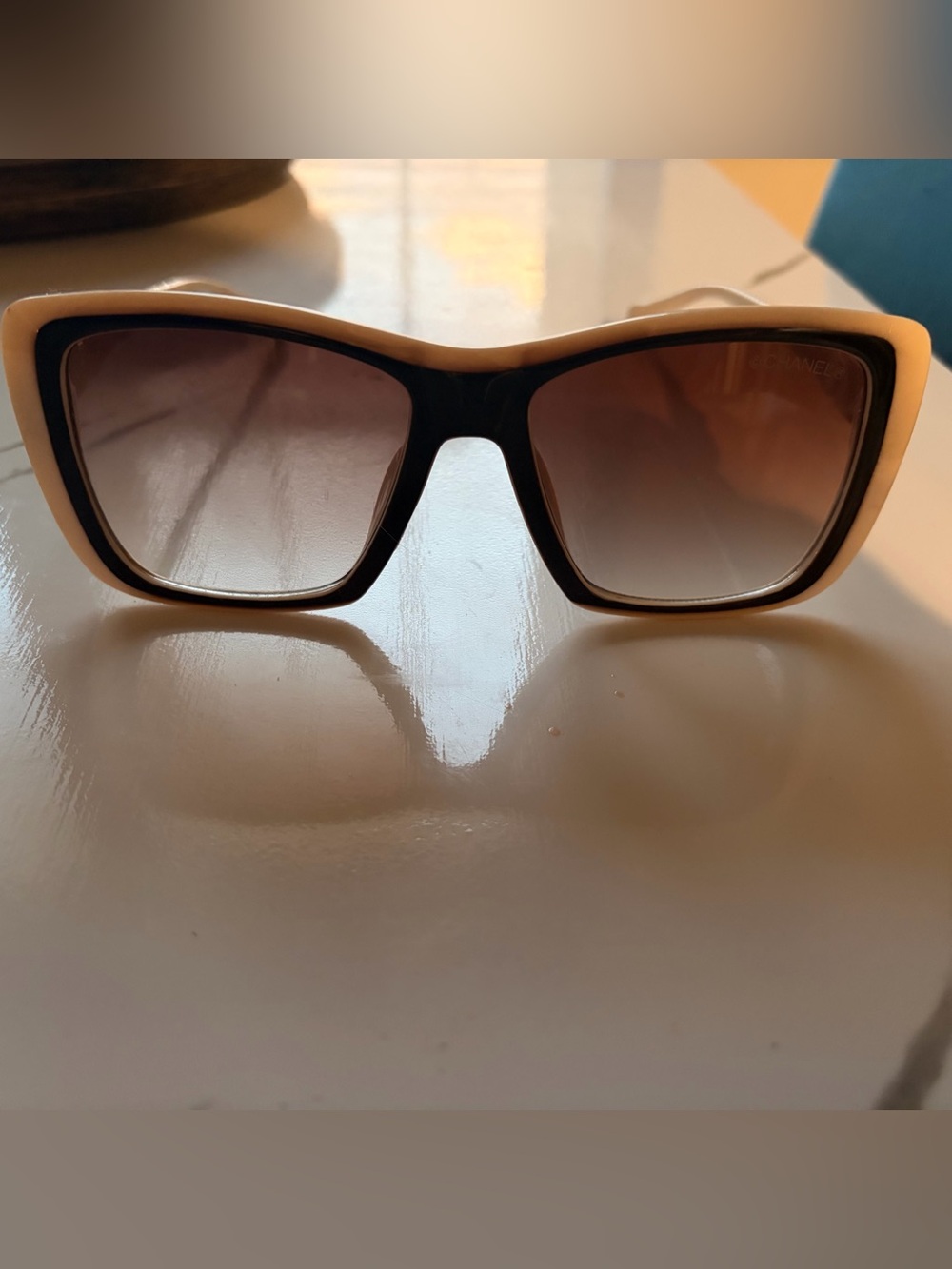 CHANEL Cream Frame Sunglasses with Crystal Accent and Black Trim